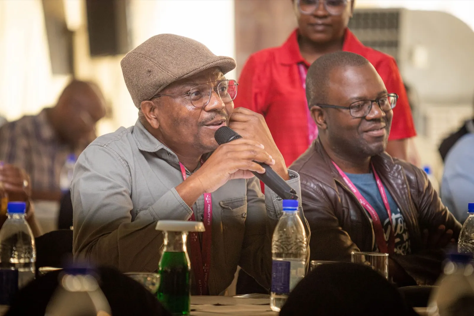 A delegate asks a question during a panel discussion