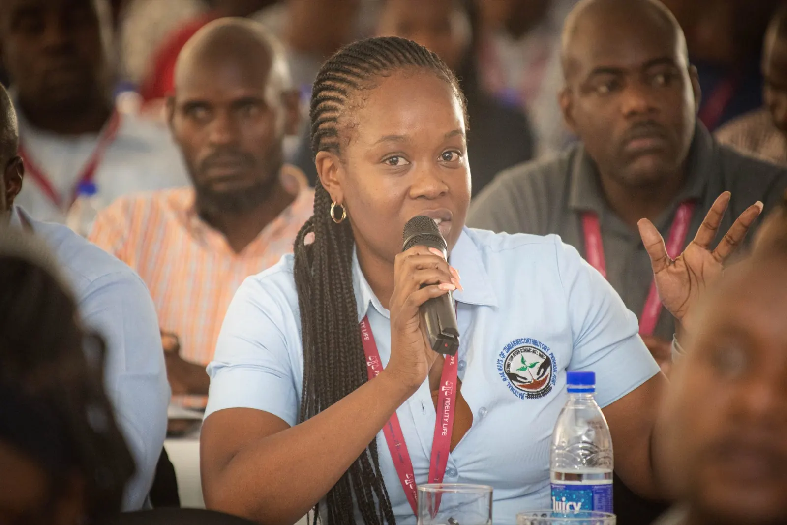 A delegate asks a question using a microphone